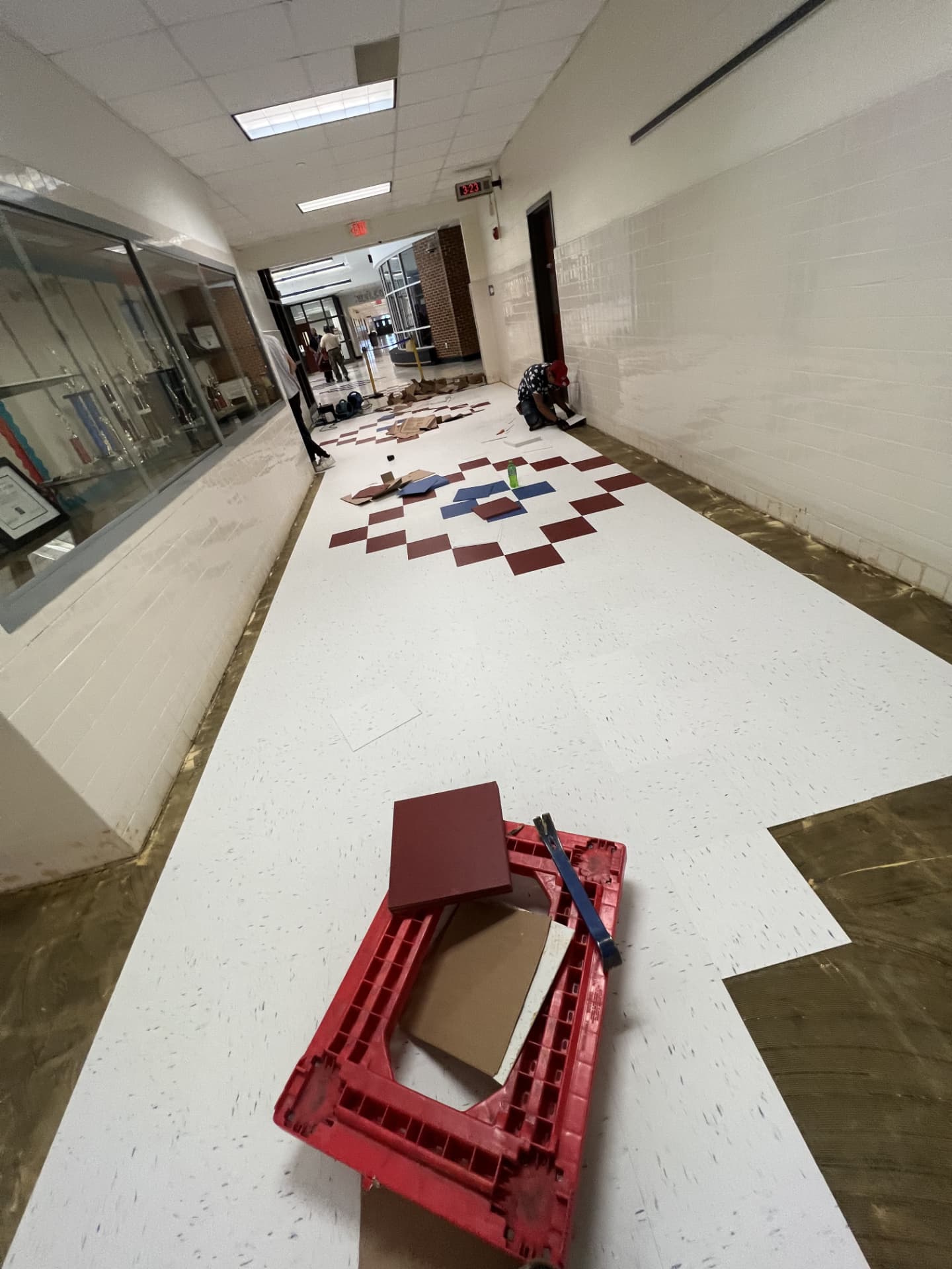 Commercial corridor tile installation in progress