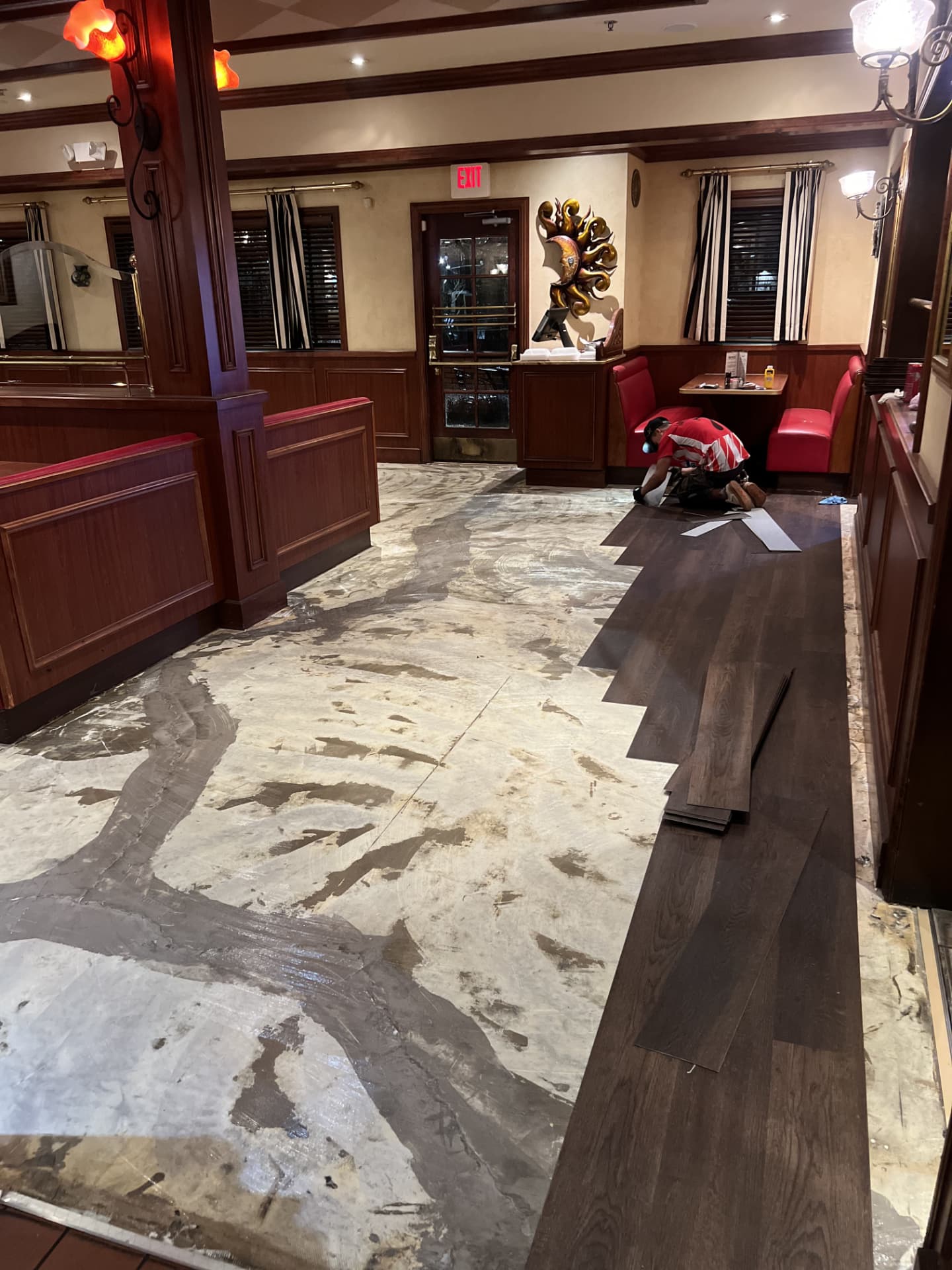 Plank flooring being fitted in a commercial restaurant