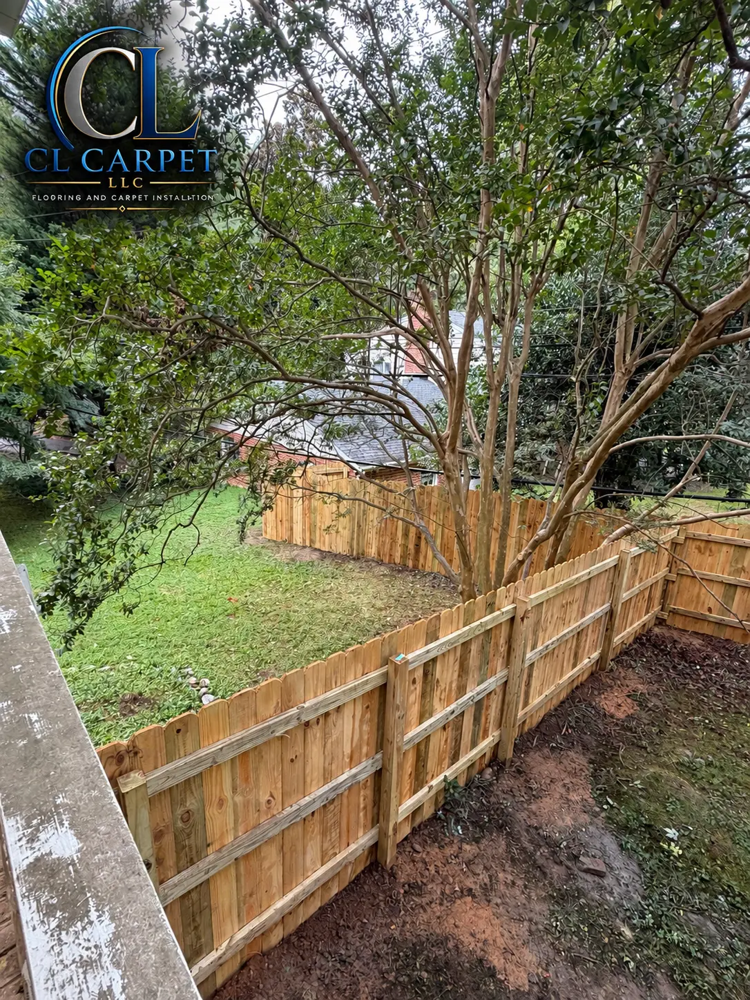 New wood privacy fence enclosing a backyard, seen from above